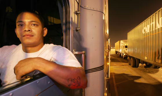 Wilfredo Jimenez waits in his truck in line at the entrance to the cargo terminal at the Port of Los Angeles earlier this month.