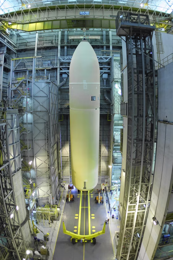 An external fuel tank for the space shuttle rises from the floor of the Vertical Assembly Building at the Michoud Assembly Facility in Louisiana, in advance of Discovery's return-to-flight mission last month.