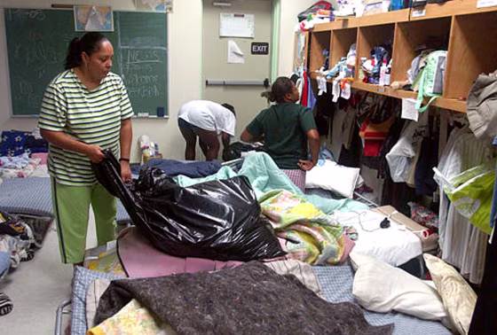 Hurricane Katrina evacuee Savonda Jones, left, sorts&nbsp;clothes&nbsp;Friday&nbsp;at Progressive Baptist Church in Lafayette La. 