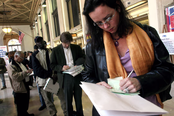 New Yorkers prepare to mail their income tax returns at Manhattan's General Post Office on the deadline for filing, April 15, 2005.