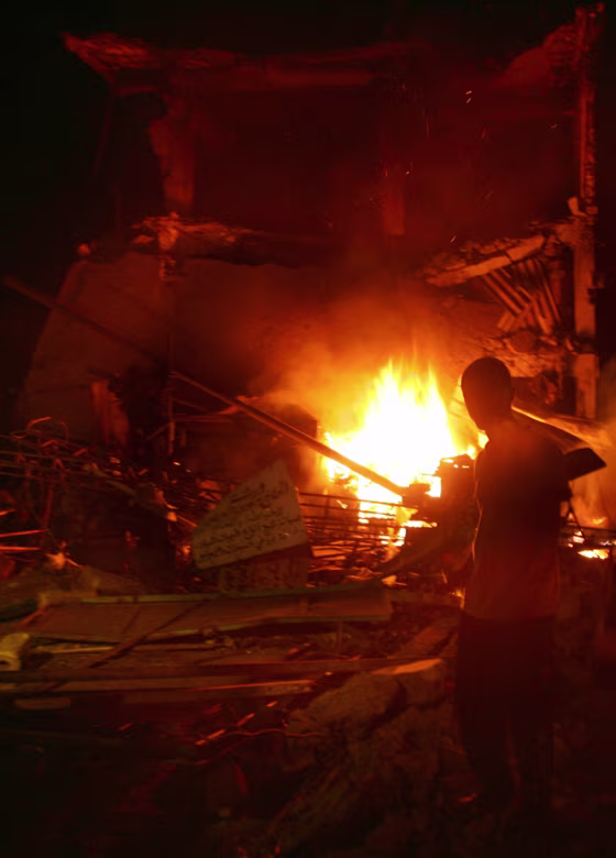 A Palestinian man looks at the destructi