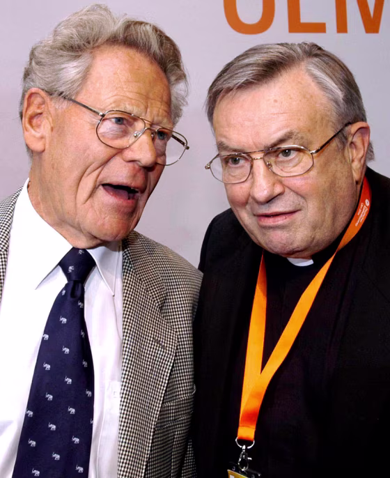 German Cardinal Karl Lehmann, right,&nbsp;talks with dissident Swiss theologian Father Hans Kueng, who was stripped of his teaching rights at Catholic universities by the Vatican in 1979, in this June 2004 photo.