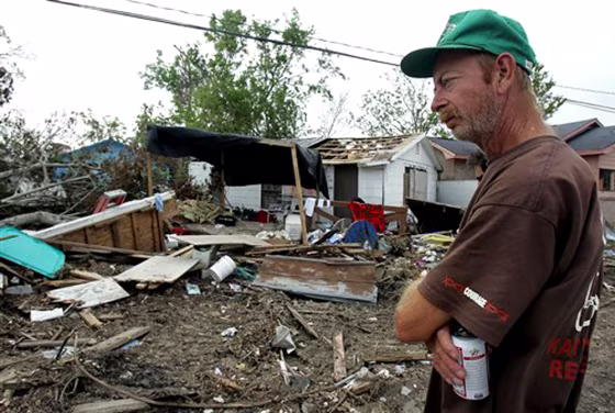 After Hurricane Katrina destroyed his house of 20 years, Mike Hardy can hardly stand to look at what remains of his property in Biloxi, Miss. Until recently Hardy and his wife lived outside on their broken porch, but now they are building a wooden floor at the base of a tent to provide&nbsp;shelter from rats and snakes that they fear are feeding on&nbsp;the debris around them.