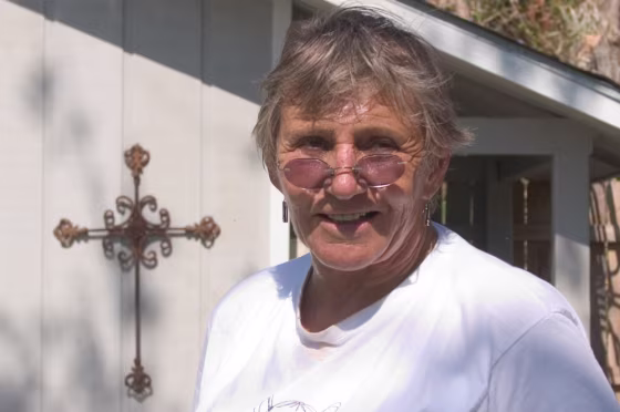 Camille Tate fled the hurricane and returned to a badly damaged house, but her roots in town run deep.