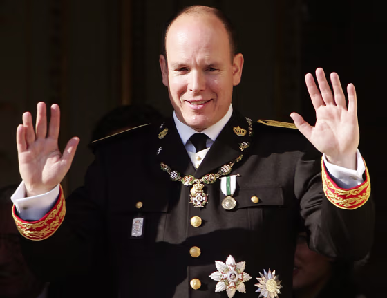 Prince Albert II of Monaco waves while a