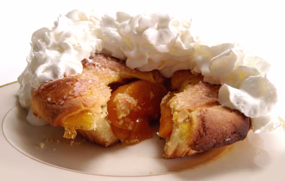 Peaches are sweet and even sweeter mixed with sugar. Add some fattening margarine with milk and flour and it's a peach cobbler.
