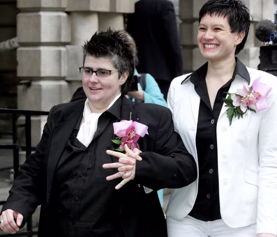 Shannon Sickels, right, and Grainne Close leave Belfast City Hall in Belfast, Northern Ireland, on Monday after becoming the United Kingdom's first gay couple to win legal recognition under a new British civil partnership law.