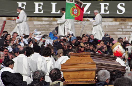 The coffin carrying the remains of nun Lucia dos Santos passes by the pilgrims  in central Portugal