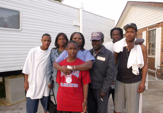 Maxine Harris and her family pose outside their home in Westwego, La. From left, nephew Carlos Page, sister Vivian Page,&nbsp;grandson&nbsp;Charles Harris, Maxine Harris, husband John Harris, and&nbsp;nephews Solomon and Corey Page.