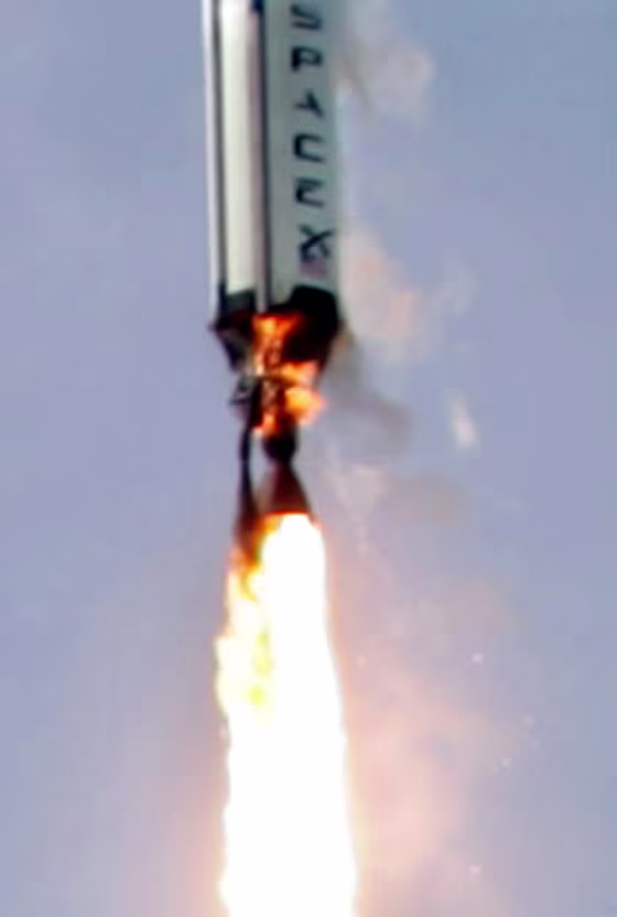 A high-resolution view shows the ascent of SpaceX's Falcon 1 rocket on Friday, with flames licking around the bottom of the first stage. SpaceX's founder says a preliminary review indicates that the flames were apparently the result of a fuel leak — and led to the loss of the rocket seconds later.
