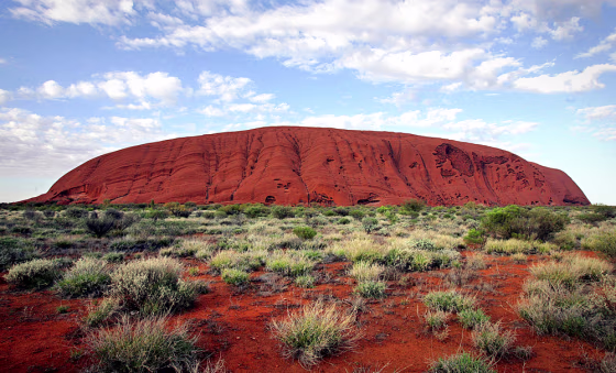 The monolith of Uluru (Ayers Rock) rises