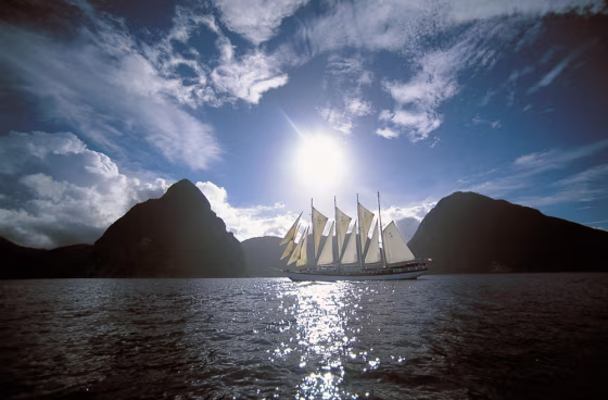 The Windjammer ship Polynesia sailing in between the Twin Pitons of the Caribbean island of St. Lucia.