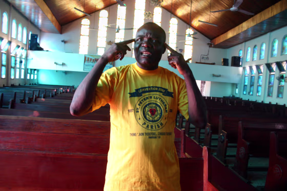 Pastor Thomas Z. Paye is seen in St. Peter's Lutheran Church, site of an infamous 1990 massacre but now getting repaired, like much of Monrovia, Liberia. 