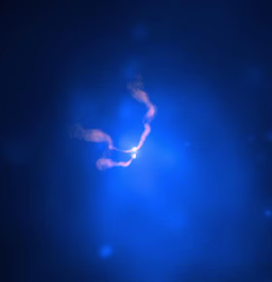 This composite X-ray/radio image of the galaxy cluster Abell 400 shows jets of superheated gas emanating from the vicinity of two supermassive black holes (bright spots in the image). 