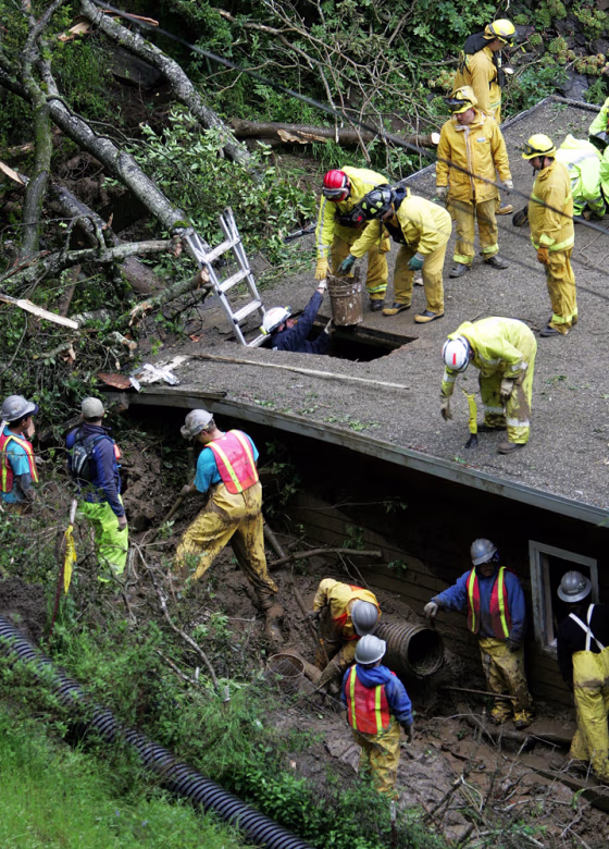 Rescuers Search For Man Trapped In Mudslide