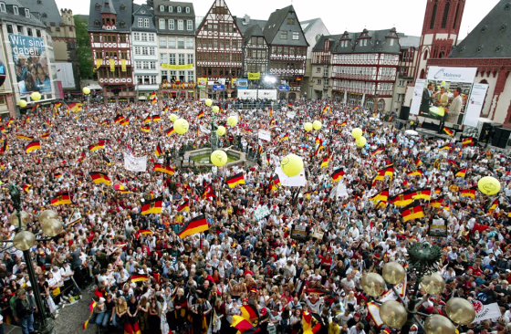 Thousands of German soccer fans celebrate prior to the reception of the German national soccer team returning from the soccer World Cup in Korea and Japan in this July 1, 2002, file photo. Germany is hoping that the million soccer fans expected for the 2006 World Cup will give its torpid economy a mighty kick.