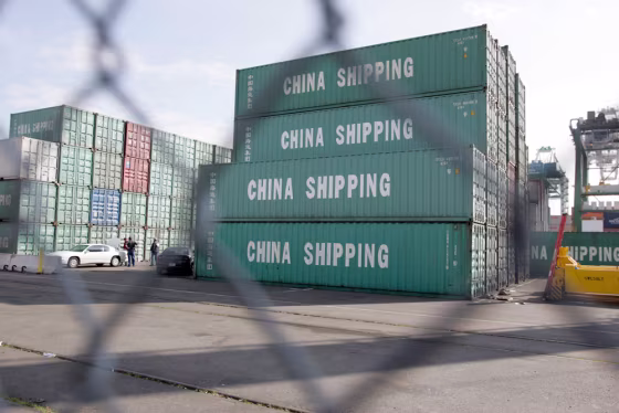 Immigration officers work at the Port of Seattle on April 5 after apprehending 22 Chinese nationals who emerged from one of these 40-foot containers, which arrived on a ship from Shanghai.