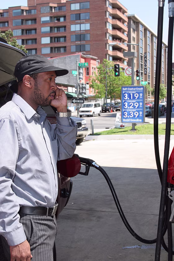 Jamal Blair fills his SUV at a Mobil gas