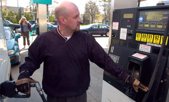 Jeff Tetu, who drives between 600-800 miles a week with a northern Michigan delivery service, fills up his truck's tank at a gasoline station, costing $77,&nbsp;April 26,&nbsp;in Traverse City, Mich.