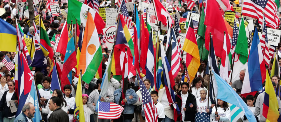 A crowd with flags from various countries gathers for an immigration-rights rally on Monday in Chicago. The demonstration is part of a nationwide action that is meant to show both support for immigration reform and opposition to legislation that would criminalize&nbsp;an estimated 11 million illegal immigrants.&nbsp; 