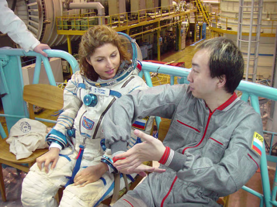 Iranian-born businesswoman Anousheh Ansari sits alongside Japanese entrepreneur Daisuke Enomoto during cosmonaut training in 2006. Ansari replaced Enomoto on a flight to the international space station, and now Enomoto is suing to get a refund.