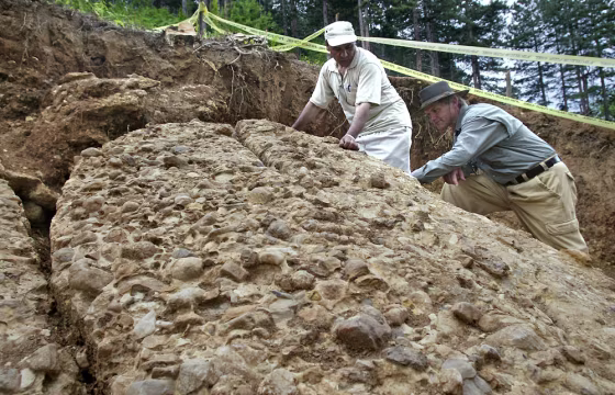 Geologists Berekat talks to Bosnian amateur archeologist Semir Osmanagic at northeastern side of Visocica hill in central Bosnia