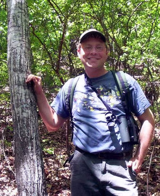 Nathan Klaus, a senior wildlife biologist with the Georgia Department of Natural Resources, stands beside a rare American chestnut tree he spotted in the F.D. Roosevelt State Park near Warm Springs, Ga.