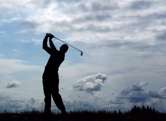 Spain's Sergio Garcia is silhouetted as he plays a shot on the opening day of the British Open golf championship at Royal Troon golf course in Troon, Scotland Thursday July 15, 2004.