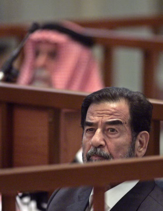 Former Iraqi President Saddam Hussein attends his trial held in Baghdad's heavily fortified Green Zone