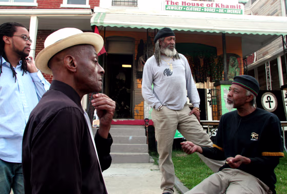 From left to right, Lionel Isaacs, Iusa Merriam, F. Raufu, and Dr. Tehuti Evans outside the House of Khamit bookstore on Georgia Avenue in NW Washington, D.C. Raufu, the bookstore owner, describes the store as a conscious place for conscious people.