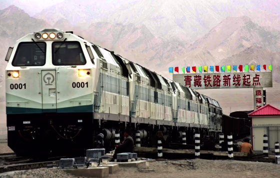 A train is seen near a board declaring the starting point of the Qinghai-Tibet railway at the Golmud Station in China's Qinghai province on June 29.