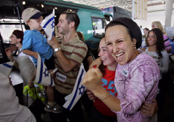 Nearly 230 immigrants from the U.S. and Canada react as they arrive at&nbsp;Ben Gurion Airport near Tel Aviv, Israel, Thursday.