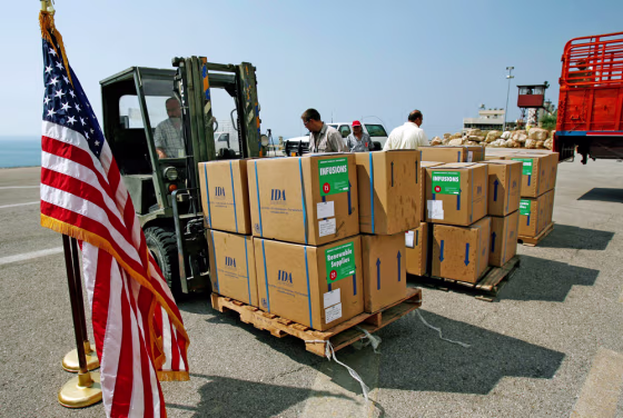Workers move boxes of aid in the U.S. embassy in Beirut on Tuesday.
