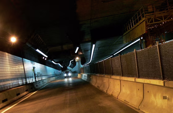 Concrete barriers with fencing divide the newly re-opened Big Dig tunnel from areas still under repair in Boston, on Wednesday, after it&nbsp;the tunnel was&nbsp;opened to traffic. 
