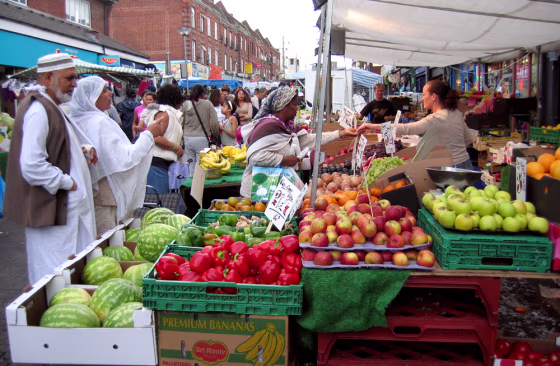 A Muslim couple, left, shops at the bustling multi-ethnic&nbsp;Walthamstow market&nbsp;Friday in East London, England.