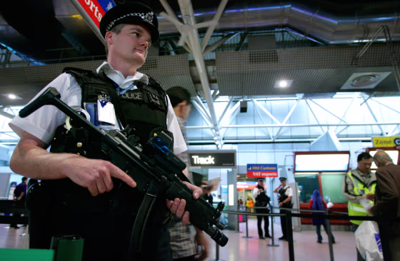 Armed British police officers patrol&nbsp;London's Heathrow Airport on&nbsp;Monday.