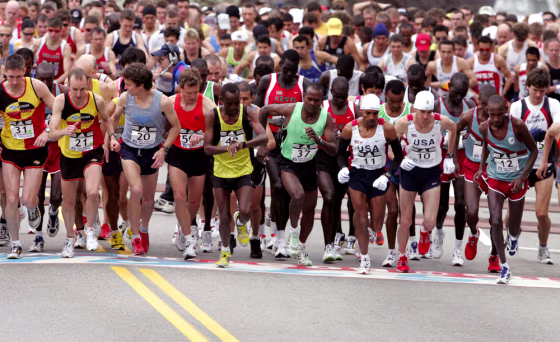 Men elite runners take off from the starting line of the Boston Marathon in Hopkinton, Massachusetts