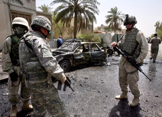 U.S. soldiers inspect the site of a car bomb explosion in Baghdad on&nbsp;Thursday. 