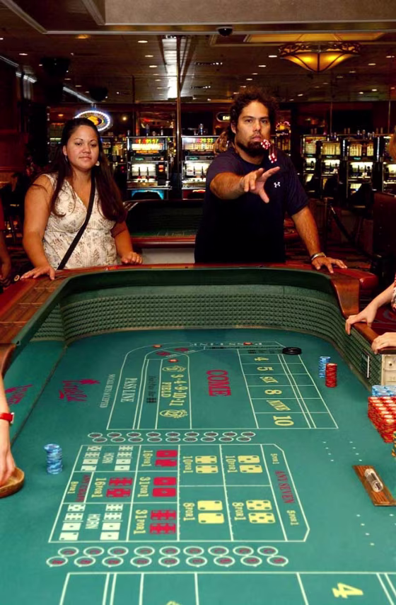 Lanakila Niles, right, and Shayna Ashley, both of Pearl City, Hawaii, play craps at the California Hotel and Casino in downtown Las Vegas on&nbsp;Aug. 16.