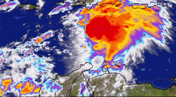 Tropical Storm Ernesto, seen over the Caribbean, is projected to become a hurricane by Tuesday.