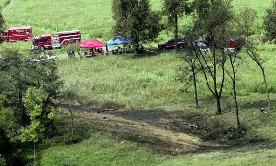Fire and impact marks are visible on the ground in a field west of Blue Grass Airport in Lexington, Ky., where Comair Flight 5191 crashed during takeoff on Sunday.
