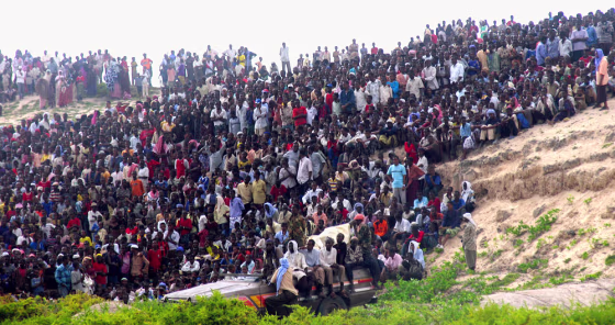 Thousands of Somali people gather to watch the execution of man accused of murdering a prominent businessman in the capital Mogadishu