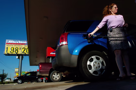 Stacy Young, of Shreveport, La., fills up with gasoline&nbsp;in Bossier City, La., shortly after the price of regular unleaded dropped below $2 a gallon for the first time in more than a year.