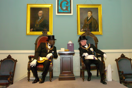 James R. Fitzgerald Jr., left, Grand Master of the Most Worshipful Prince Hall Grand Lodge Free and Accepted Masons of Delaware, and Ronald W. Conaway, right, Grand Master of the Most Worshipful Grand Lodge of Ancient Free and Accepted Masons of Delaware, talk before a ceremony of recognition at the Grand Opera House in Wilmington, Del., in this Sept. 16 file photo. 