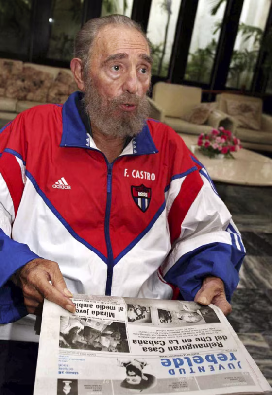 Cuba's President Castro holds local Saturday newspaper in Havana
