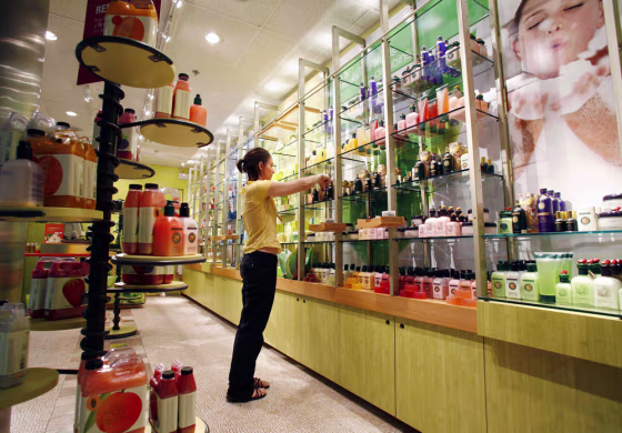 Meleta Smith cleans shelves at Fruits & Passion body and bath store in Calgary's International airport