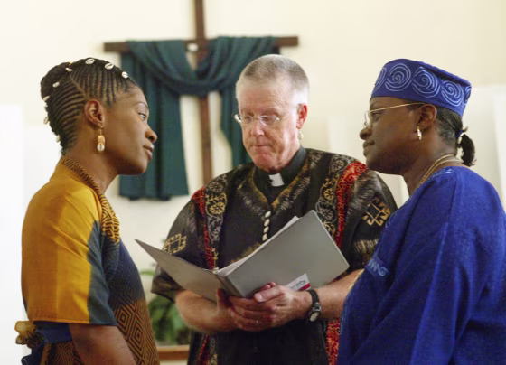Madeline Jones, left, and Vinyelle White take their vows during their same-sex wedding at the Metropolitan Church in Richmond, Va. The African-themed ceremony is not recognized in the eyes of the state.