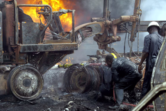 Firefighters try to put off the fire at