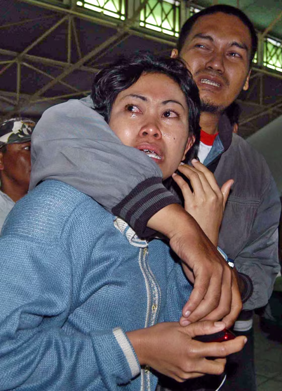 Relatives wait for news on a sunken&nbsp;vessel at Tanjung Mas port in Semarang, Central Java, Indonesia, on Saturday.