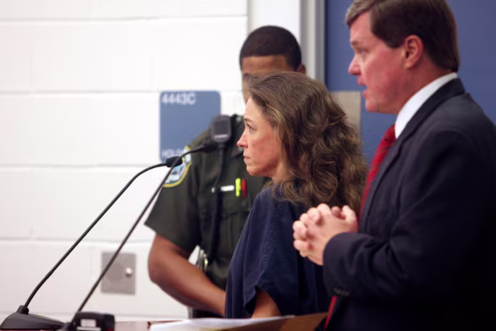 Attorney Donald Lykkebak(R) appears befo
